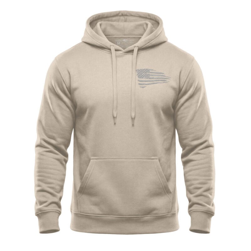 Beige hoodie with distressed American flag design on chest for patriotic style.
