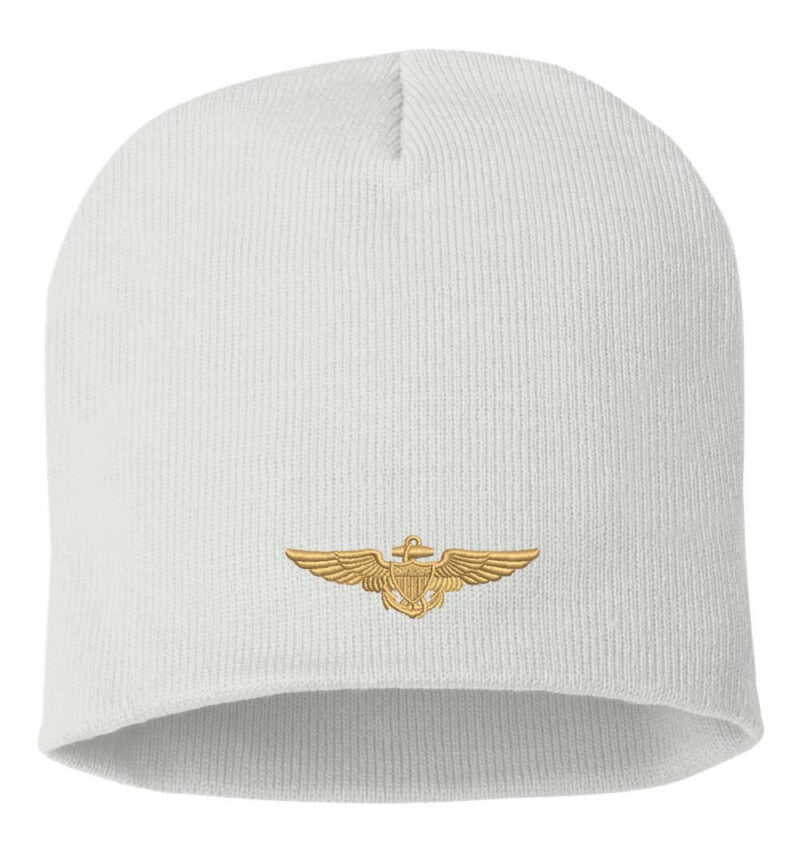White beanie with gold embroidered US Navy Aviator Pilot Wings design, featured on a product page for Navy Pilot Beanies.