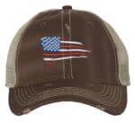 Distressed trucker hat with embroidered American flag, ideal for showcasing patriotic pride in style.