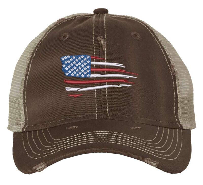 Distressed trucker hat with embroidered American flag, ideal for showcasing patriotic pride in style.