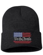 Black beanie with a distressed American flag and "We The People" text, perfect gift for a patriot or fan of USA-themed apparel.