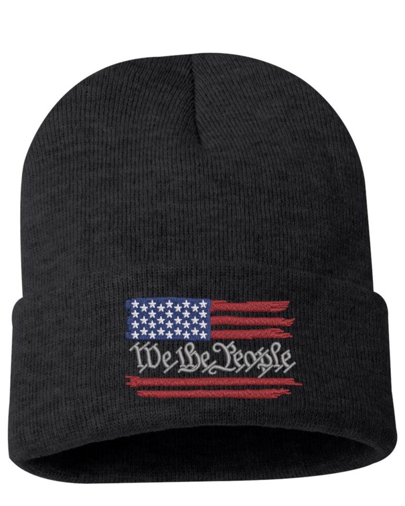Black beanie with a distressed American flag and "We The People" text, perfect gift for a patriot or fan of USA-themed apparel.