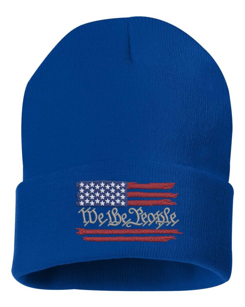 Blue beanie with a distressed American flag and "We The People" text embroidered in red, white, and blue design.