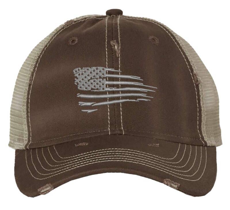 Silver distressed trucker hat with embroidered American flag, perfect for showcasing patriotic pride in style.