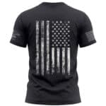 Black T-shirt featuring a distressed American flag graphic for patriotic style.