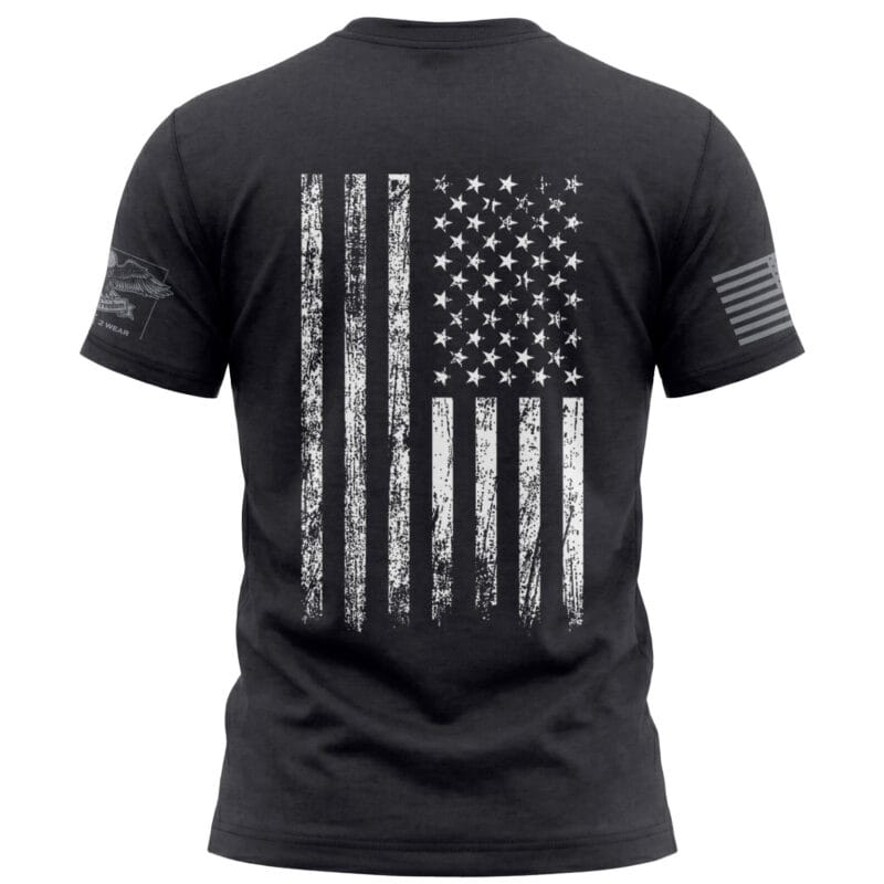 Black T-shirt featuring a distressed American flag graphic for patriotic style.