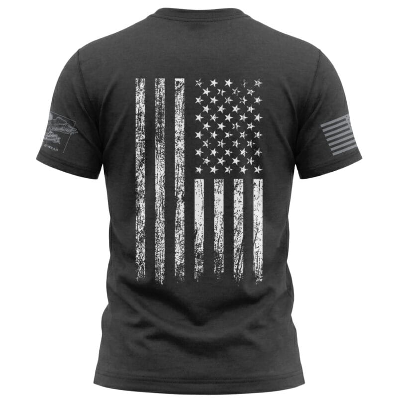 Black T-shirt featuring a distressed American flag graphic for patriotic style.