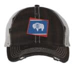 Distressed Wyoming trucker hat with embroidered state flag design, mesh back, and adjustable strapback closure.