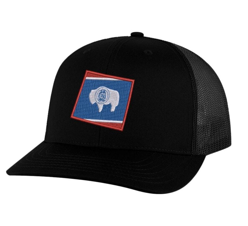 Classic Wyoming trucker hat with embroidered state flag design, mesh back, and adjustable snapback closure.