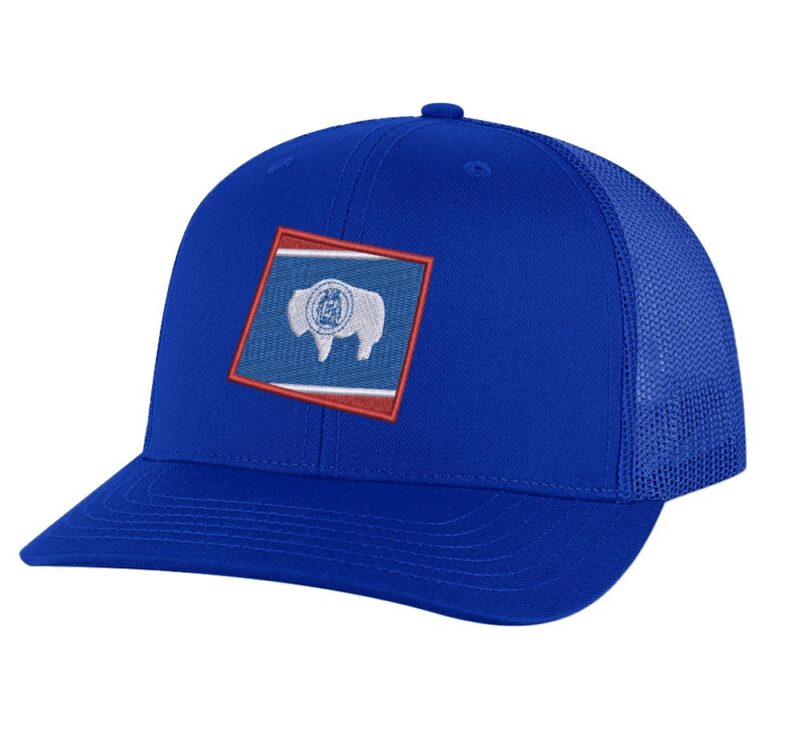 Classic Wyoming trucker hat with embroidered state flag design, mesh back, and adjustable snapback closure.