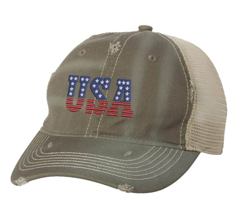 USA distressed trucker hat with weathered finish, embroidered USA lettering in red, white, and blue colors, mesh back and adjustable strapback closure