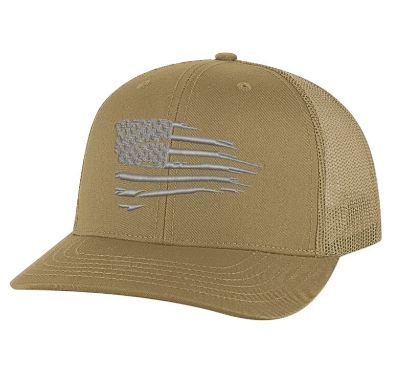 Patriotic trucker cap featuring a distressed flag design in silver thread"