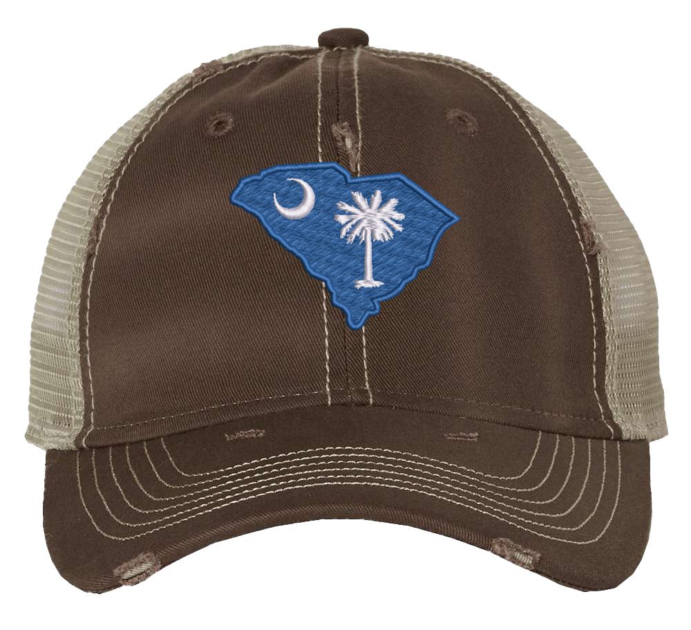 Distressed South Carolina trucker hat with embroidered state flag design, mesh back, and adjustable strapback closure.