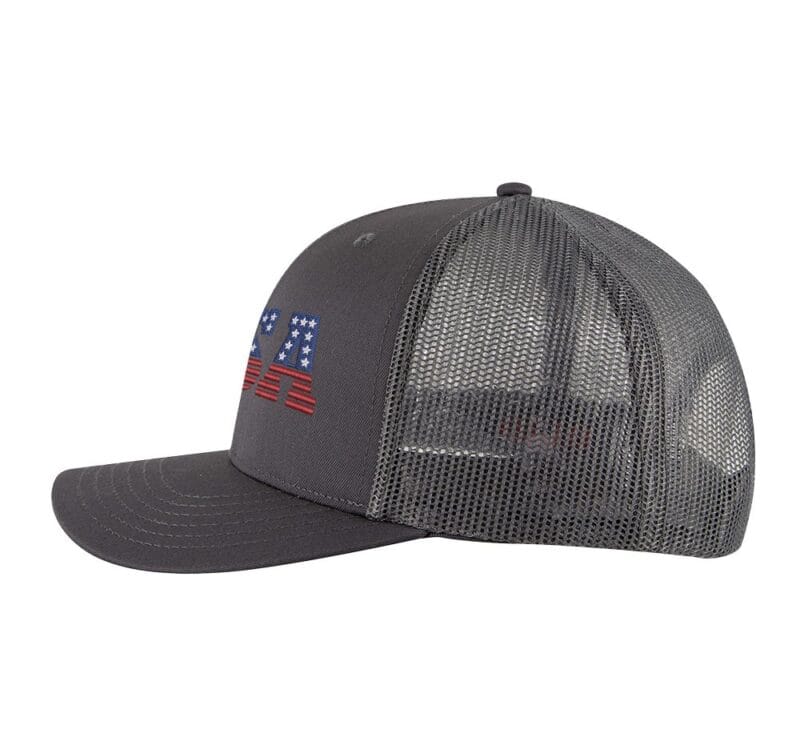 USA trucker hat with embroidered American flag letters, snapback mesh cap for patriotic wear.