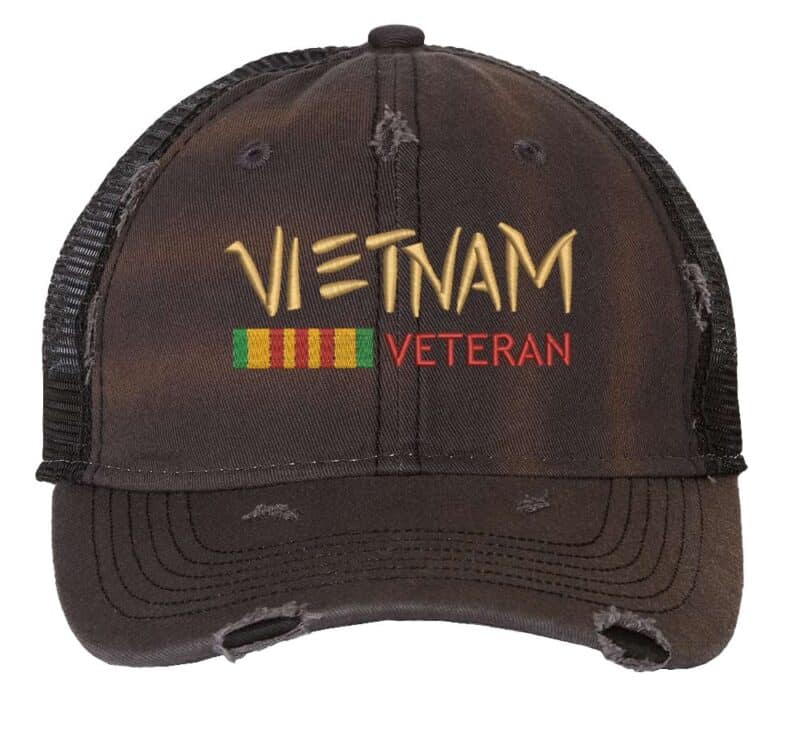 Distressed Vietnam Veteran trucker hat with embroidered military design, strapback mesh cap for veterans and military supporters.