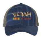 Distressed Vietnam Veteran trucker hat with embroidered military design, strapback mesh cap for veterans and military supporters.