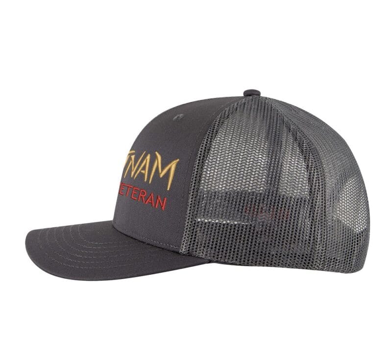 Vietnam Veteran trucker hat with embroidered design and snapback closure, mesh back cap for veterans and military supporters.