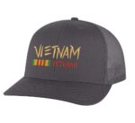 Vietnam Veteran trucker hat with embroidered design and snapback closure, mesh back cap for veterans and military supporters.