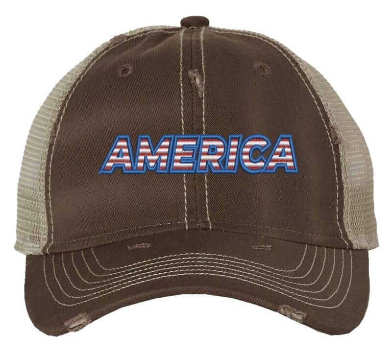 Distressed trucker hat with "AMERICA" embroidery in flag colors, mesh back panel, and adjustable strap closure