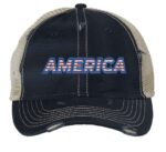 Distressed trucker hat with "AMERICA" embroidery in flag colors, mesh back panel, and adjustable strap closure