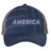 Distressed trucker hat with "AMERICA" embroidery in flag colors, mesh back panel, and adjustable strap closure