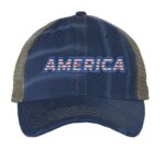 Distressed trucker hat with "AMERICA" embroidery in flag colors, mesh back panel, and adjustable strap closure