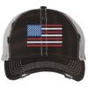 Distressed trucker hat with embroidered American flag design, mesh back panel, and adjustable strap closure