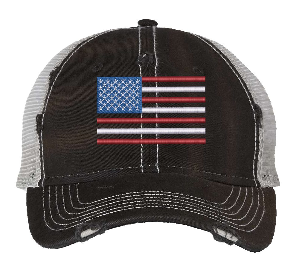 Distressed trucker hat with embroidered American flag design, mesh back panel, and adjustable strap closure