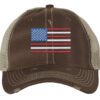Distressed trucker hat with embroidered American flag design, mesh back panel, and adjustable strap closure
