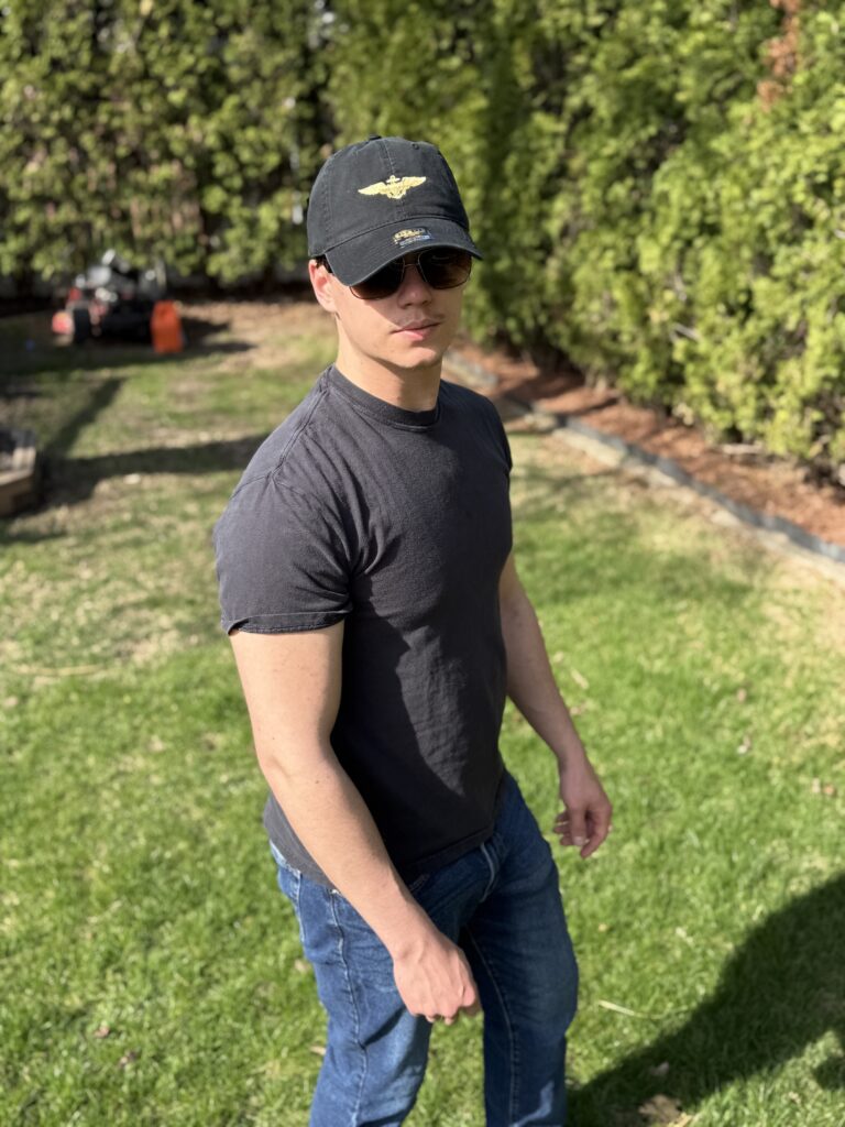 Model wearing USA pride clothing embroidered cap showcasing patriotic style
