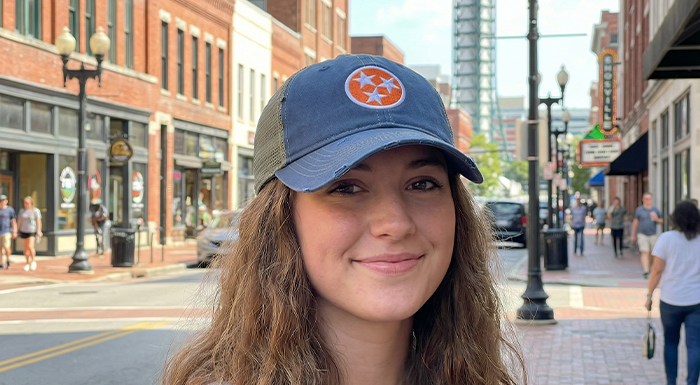 Pretty girl wearing Tennessee Orange hat in Knoxville TN on the street