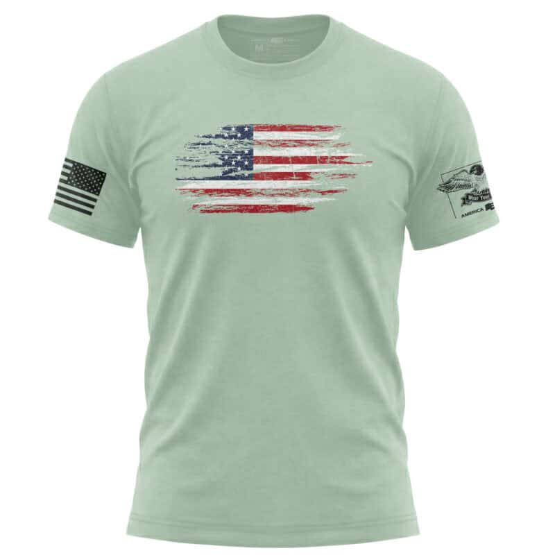 Men's American flag t-shirt with distressed flag design and patriotic patches.
