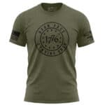 Military green "Born Free 1776" patriotic T-shirt with distressed design.