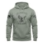 Patriotic hoodie featuring distressed eagle design, "Live Free or Die Trying" slogan, in sage color,.