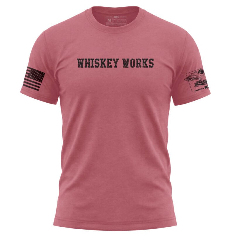 Distressed Whiskey Works T-Shirt in Dusty Rose with bold lettering and patches.