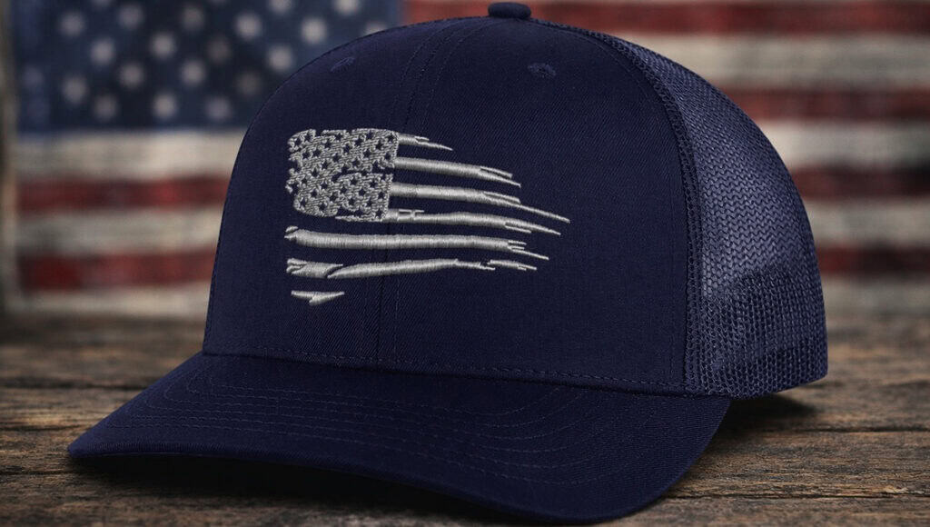 embroidered american flag hat navy trucker cap close up showing detailed stitching patriotic headwear usa