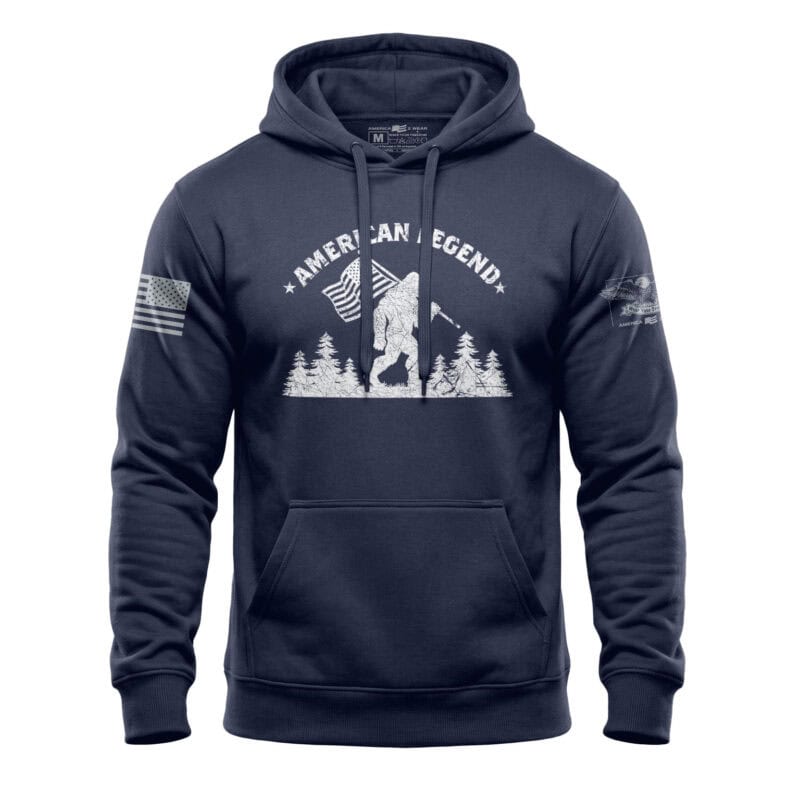 Hoodie featuring Bigfoot and patriotic American flag design in navy fleece, perfect for outdoor and.