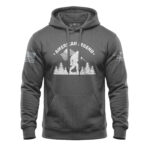 Hoodie featuring Bigfoot silhouette with patriotic flags and trees, perfect for outdoor enthusiasts.