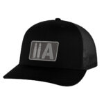 Black trucker cap with America 2 Wear bullet logo patch, adjustable mesh back.