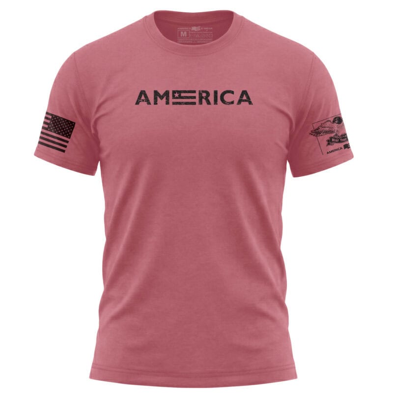 Pink American flag T-shirt with USA text and flag patch on sleeve.