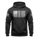 Black hoodie featuring a distressed American flag design on chest and sleeve, casual and patriotic a.