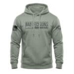 Sage hoodie with "Bad Decisions" graphic, American flag patch, and sleeve design.