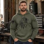 Men's green hoodie with distressed buffalo graphic and American flag patch detail.