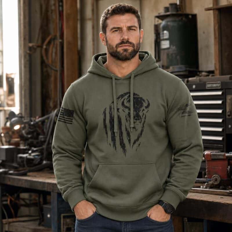 Men's green hoodie with distressed buffalo graphic and American flag patch detail.