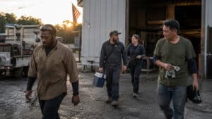 American workers leaving an industrial workplace at the end of the day, representing the people and labor history behind Labor Day.